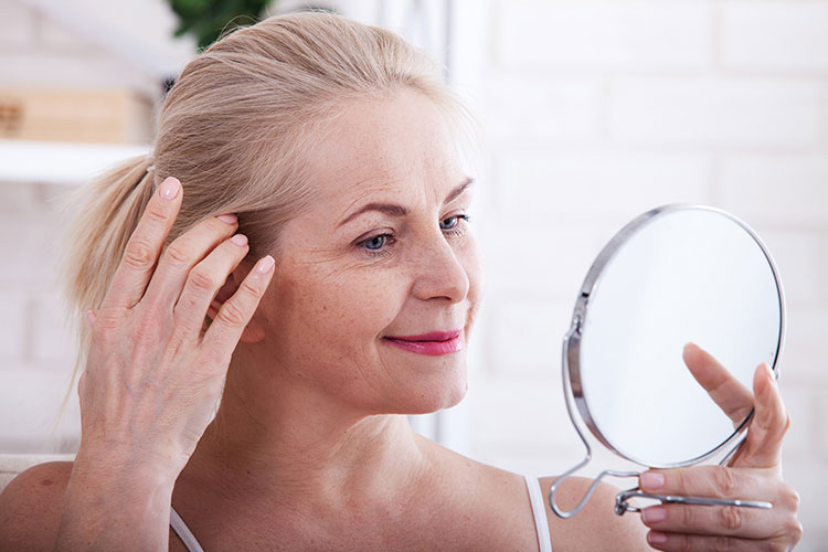 How Long Does it Take for Sermorelin to Work Older Woman Looking at the Mirror